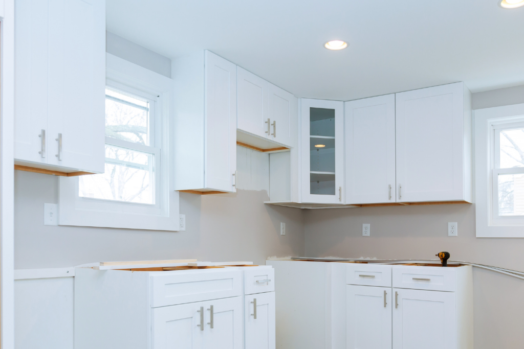 A modern kitchen featuring elegant white cabinets, providing a clean and bright aesthetic to the space.