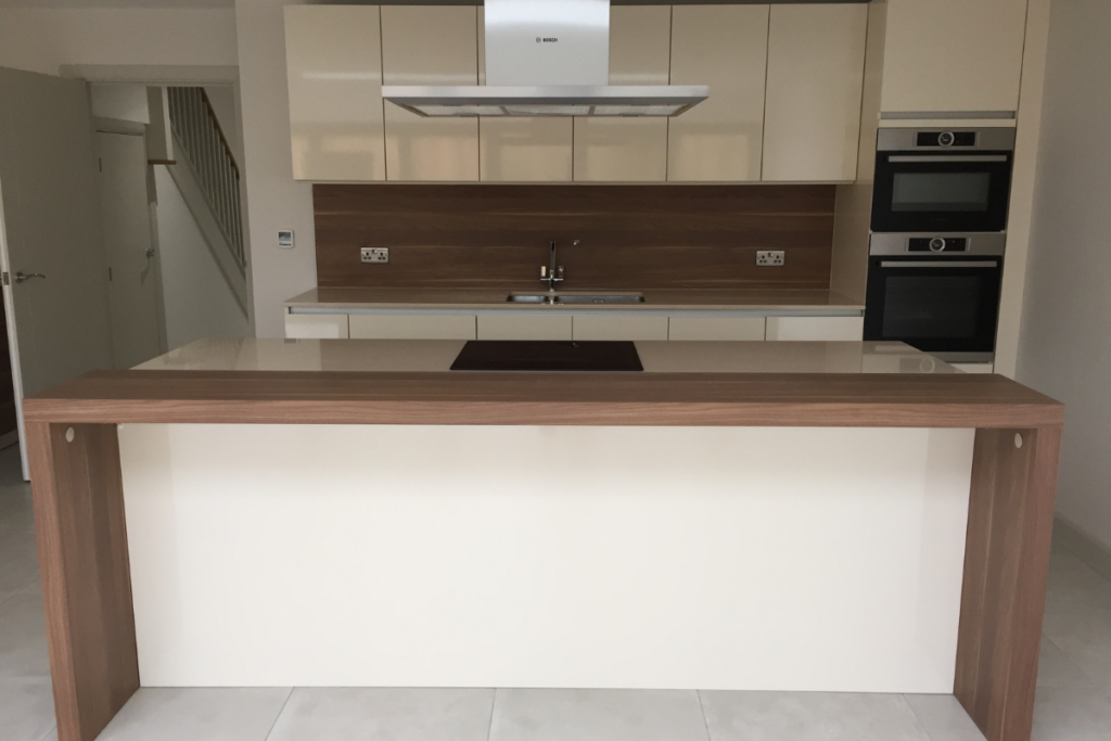 A kitchen featuring a counter and sink, showcasing a clean and functional cooking space.